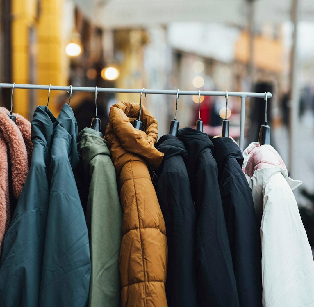 a rack of clothes hanging on a rail